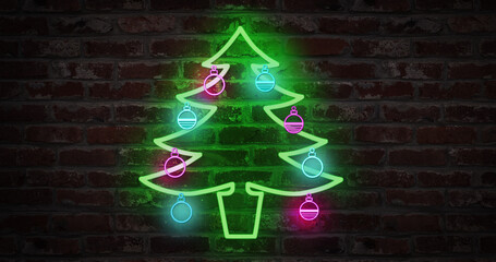 Christmas tree neon light sign on brick wall