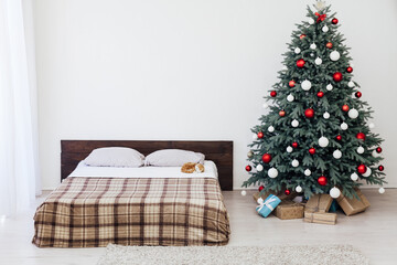 bedroom with bed New Year holiday gifts Christmas tree decor