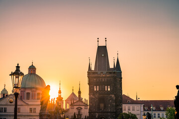 Fototapeta na wymiar Charles bridge tower in Prague on sunrise, Czech Republic