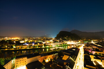 Centre of Salzburg city overlooking Salzach river at night. Austria
