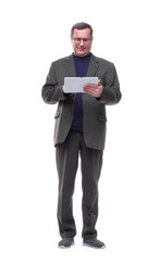 in full growth. Mature man using a digital tablet.