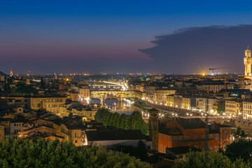 Fototapeta na wymiar Night view of Florence city skyline with Arno River and Ponte Vecchio