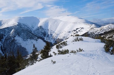 Beautiful mountain winter view during a snowshoe trip from Certovica to Dumbier - the highest peak of the Low Tatras in Slovakia