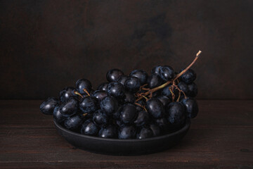 Fresh Dark blue purple grape isolated on white background.
