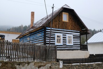 Interesting traditional wooden buildings in Sumiac (Šumiac) village, lying at feet of Kralova hola in Low Tatras in Slovakia © Iwona