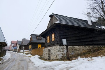 Interesting traditional wooden buildings in Sumiac (Šumiac) village, lying at feet of Kralova hola in Low Tatras in Slovakia © Iwona