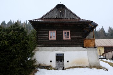 Interesting traditional wooden buildings in Sumiac (Šumiac) village, lying at feet of Kralova hola in Low Tatras in Slovakia © Iwona