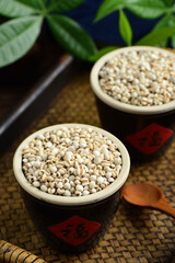 Barley seed rice on the background of retro Chinese style.The Chinese meaning in the picture is happiness