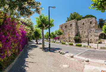Ancient Roman Agora wall and colorful street view in Kos Town 