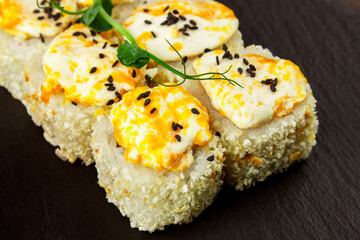 Set of different salmon sushi and rolls, top view