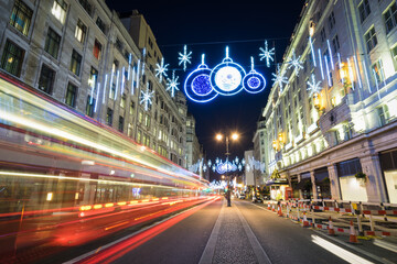Fototapeta na wymiar The beautiful Christmas lights illuminating the Strand district in central London. England