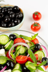 Olives and olive oil and vegetable salad in studio