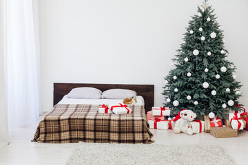 bedroom with bed New Year holiday gifts Christmas tree decor