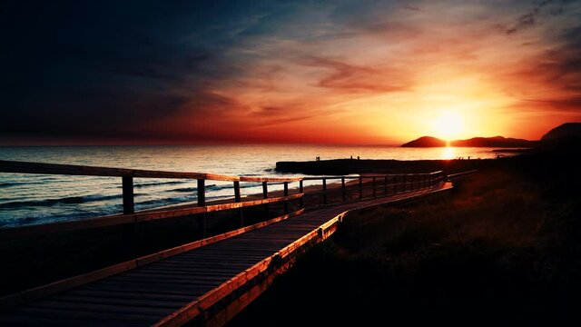 Seascape. Red orange color sunset over sea. Cala Magre beach, Calblanque Park  in Murcia region Spain.