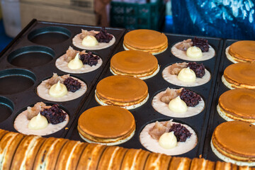 Obanyaki also known as Imagawayaki. Japanese dessert often found at Japanese festivals as well as outside Japan. It is made of batter in a special pan
