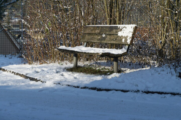 A park bench with a wooden seat