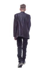 rear view. confident guy walking away. isolated on a white