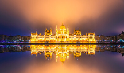 Fototapeta na wymiar Hungarian parliament at night with reflection in Danube river. Budapest. Europe