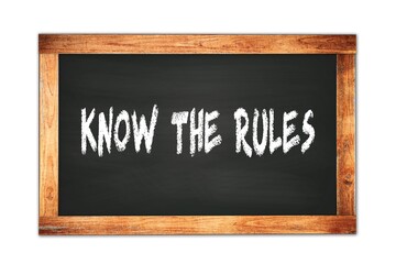 KNOW  THE  RULES text written on wooden frame school blackboard.