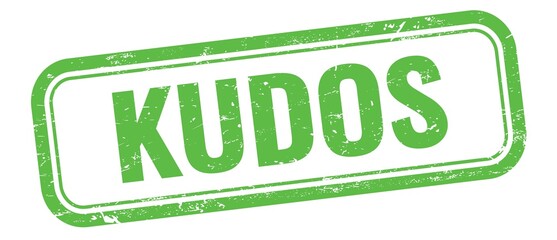 KUDOS text on green grungy vintage stamp.