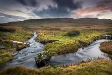 The river Tawe and the summit of Moel Feity near the source of the river in the Brecon Beacons,...