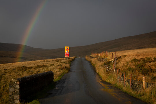 A rainbow over the old road to Trecastle in South Wales UK
