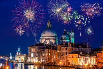 Fototapeta na wymiar Fireworks near Basilica Santa Maria della Salute at Grand canal in Venice, Italy