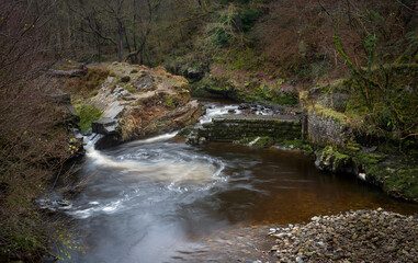 The Avon Mellte river at the remains of the Gunpowder Works at Pontneddfechan, South Wales. 