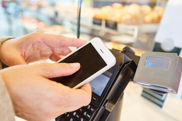 Hands hold smartphone with app for contactless payment