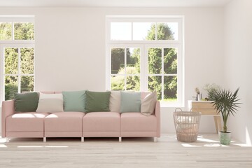 White living room with sofa and summer landscape in window. Scandinavian interior design. 3D illustration