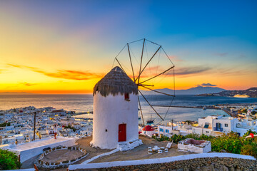 Obraz premium Traditional Greek windmill at sunset in Mykonos island. Greece
