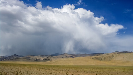 Spectacular sky above high-altitude desert along Pamir Highway between Ak Baital pass and Karakul lake, Murghab district, Gorno-Badakshan, Tajikistan