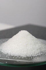 Weighing Sugar on Kitchen Scale