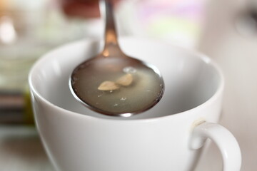 Lemon juice in spoon. Making Chicken and Egg Galette Series.