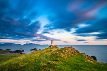 Lighthouse on Llanddwyn Island viewed at sunset. North Wales. UK