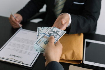 The concept of anti-bribery and corruption. Businessmen refuse and do not receive money banknote...