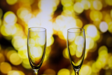 Two glasses of champagne on a bokeh background. Close-up isolated background.