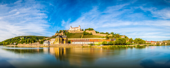 Fototapeta premium Skyline panorama of Wurzburg with Marienberg Fortress and reflection of the city in Main River. Germany