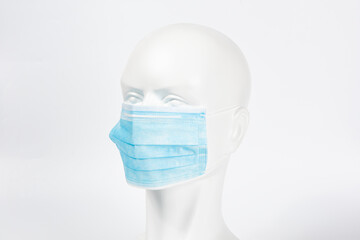 dummy model wearing a medical face mask