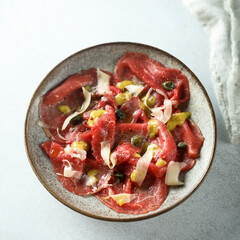 Traditional homemade beef carpaccio with capers