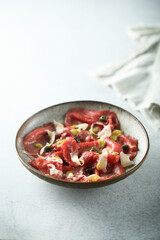 Traditional homemade beef carpaccio with capers
