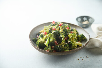 Broccoli with pomegranate seeds