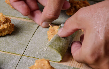 Step by step of making homemade ravioli..Chef's hands sculpt..Top view.