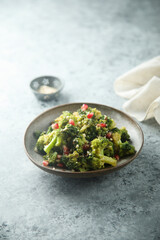 Broccoli with pomegranate seeds