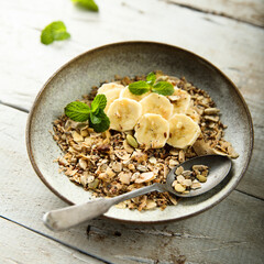 Homemade granola with fresh banana