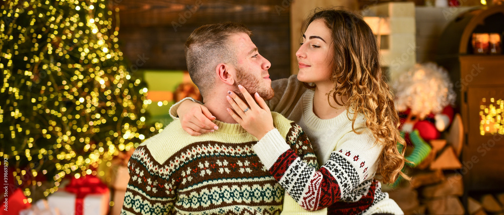 Wall mural kiss your beloved under mistletoe. spend new year together. couple in love. tender moment of relatio