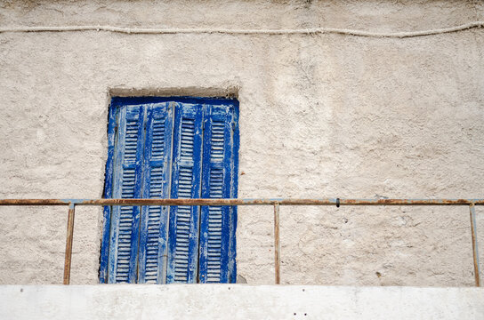 Entrance door to the terrace of an abandoned house in Epidos on the island of Evia, Greece 