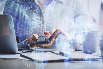 Double exposure of forex chart sketch hologram and woman holding and using a mobile device. Financial market concept.