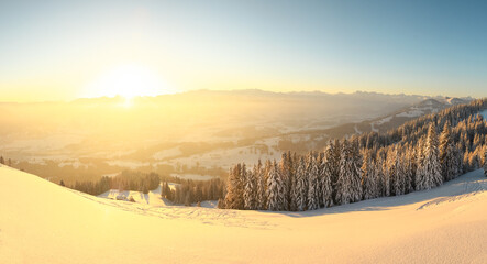 Beautiful Sunrise in snow mountains landscape. Amazing yellow Sunshine. Allgau, Mittag Mountain, Bavaria, Alps, Germany.