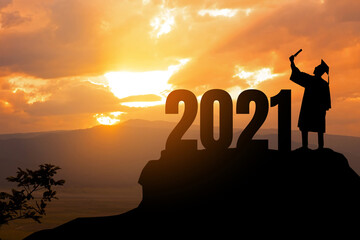 Silhouette Young man Graduation in 2021 years, education congratulation concept ,Freedom and Happy...